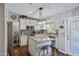 Modern kitchen with white cabinets, granite countertops, stainless steel appliances, and a stylish backsplash at 15410 N 60Th Ave, Glendale, AZ 85306