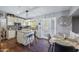 Well-lit kitchen features an island, granite countertops, and stainless steel appliances at 15410 N 60Th Ave, Glendale, AZ 85306