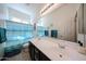Bright bathroom with double sink vanity, large mirror, and blue accents at 16368 W Cortez St, Surprise, AZ 85388