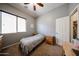 Cozy bedroom with neutral walls, carpeted floor, and bright natural light at 16368 W Cortez St, Surprise, AZ 85388