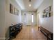 Spacious foyer with tile flooring, decorative art and a welcoming entrance at 16368 W Cortez St, Surprise, AZ 85388