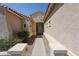 Inviting home entrance with a paved walkway and desert-friendly landscaping at 16368 W Cortez St, Surprise, AZ 85388
