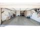 Well-lit garage showcasing ample storage solutions and a clean, organized space for vehicles and tools at 16368 W Cortez St, Surprise, AZ 85388