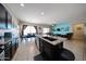 Open-concept kitchen with a granite island that offers a full view of the living and dining area at 16368 W Cortez St, Surprise, AZ 85388
