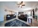 Open-concept living room seamlessly connects to the dining and kitchen areas, creating an inviting space at 16368 W Cortez St, Surprise, AZ 85388