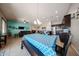 Spacious living area with a dining table, seamlessly connected to the open-concept kitchen at 16368 W Cortez St, Surprise, AZ 85388