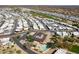 Community aerial view showcasing well-maintained streets, landscaping, a pool, and common gathering areas at 17200 W Bell Rd # 1801, Surprise, AZ 85374