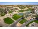 Beautiful landscape of a golf course with greenways, a serene pond, and a well-manicured lawn at 17200 W Bell Rd # 1801, Surprise, AZ 85374