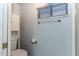 Cozy bathroom features toilet, cabinet, and window with natural light at 17200 W Bell Rd # 1801, Surprise, AZ 85374