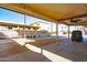 Wide shot of carport with desert landscaping and surrounding community homes at 17200 W Bell Rd # 1801, Surprise, AZ 85374
