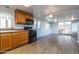 Open kitchen has black appliances, light cabinets, and luxury vinyl plank flooring at 17200 W Bell Rd # 1801, Surprise, AZ 85374