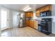 Beautiful kitchen features stainless fridge, matching black appliances, and ample cabinet space at 17200 W Bell Rd # 1801, Surprise, AZ 85374