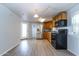 Modern kitchen featuring stainless steel refrigerator, black appliances, and light cabinets at 17200 W Bell Rd # 1801, Surprise, AZ 85374