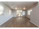 Spacious living room with light wood flooring, white walls, and a sliding door for a bright, airy feel at 17200 W Bell Rd # 1801, Surprise, AZ 85374