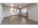 The living room features vinyl flooring, a stair chair lift, and a sliding door to the outside at 17200 W Bell Rd # 1801, Surprise, AZ 85374