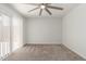 Bright bedroom features a ceiling fan and sliding doors to a patio, bringing the outdoors in at 1822 S River Dr, Tempe, AZ 85281