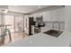 Modern kitchen featuring white cabinets, stainless steel appliances, and quartz countertop at 1822 S River Dr, Tempe, AZ 85281