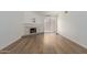 Spacious living room with hardwood flooring, a fireplace and bright lighting at 1822 S River Dr, Tempe, AZ 85281