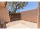 Enclosed brick patio surrounded by block wall and mature tree creating privacy at 1822 S River Dr, Tempe, AZ 85281
