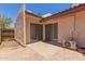 Back patio with sliding door access and AC unit featuring concrete and brick at 1822 S River Dr, Tempe, AZ 85281