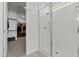 Modern bathroom features a tiled walk-in shower and closet access, perfect for a relaxing experience at 18854 W Poinsettia Dr, Surprise, AZ 85388