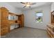 Well-lit bedroom with built in bed and a view to the outdoors at 18854 W Poinsettia Dr, Surprise, AZ 85388