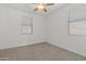 Bright bedroom featuring large windows with blinds at 18854 W Poinsettia Dr, Surprise, AZ 85388