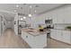 Spacious kitchen featuring stainless steel appliances, an island, and ample white cabinetry at 18854 W Poinsettia Dr, Surprise, AZ 85388