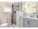 Updated bathroom featuring modern fixtures, a tiled shower with a glass enclosure, and a neutral color palette at 1916 W Tonto St, Phoenix, AZ 85009