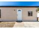 Front exterior of a single-story home with a secure entryway and well-maintained facade at 1916 W Tonto St, Phoenix, AZ 85009