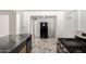 Bright kitchen featuring updated stainless steel appliances and stylish tile flooring at 1916 W Tonto St, Phoenix, AZ 85009