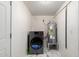 Functional laundry area featuring a modern washer/dryer, and a water heater at 1916 W Tonto St, Phoenix, AZ 85009