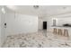 Open living space with tile floors and kitchen bar, ideal for entertaining and modern living at 1916 W Tonto St, Phoenix, AZ 85009