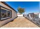 View of a home's spacious side yard, enclosed with a decorative block and wrought iron fence at 1916 W Tonto St, Phoenix, AZ 85009