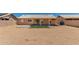 Wide backyard featuring desert landscaping, artificial turf, and covered patio at 19802 N 3Rd Ave, Phoenix, AZ 85027