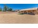 Spacious backyard with desert landscaping, covered patio, and artificial turf at 19802 N 3Rd Ave, Phoenix, AZ 85027