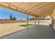 Desert backyard with gravel, small patch of turf, and a covered patio area at 19802 N 3Rd Ave, Phoenix, AZ 85027