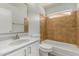 Bathroom features tiled shower over tub and updated vanity at 19802 N 3Rd Ave, Phoenix, AZ 85027