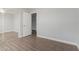 Bedroom with mirrored closet door and wood-look flooring at 19802 N 3Rd Ave, Phoenix, AZ 85027