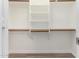 Organized walk-in closet with shelving and rods for optimal storage at 19802 N 3Rd Ave, Phoenix, AZ 85027