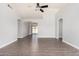 Open living room boasts wood-look floors, ceiling fan, and natural light at 19802 N 3Rd Ave, Phoenix, AZ 85027
