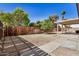 Fenced in backyard with low maintenance landscaping and mature shade trees at 2018 W Taro Ln, Phoenix, AZ 85027