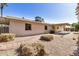 The backyard has a covered patio and a beautiful stone path at 2018 W Taro Ln, Phoenix, AZ 85027