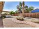 Private backyard featuring desert landscaping, a stone path, and a wood fence at 2018 W Taro Ln, Phoenix, AZ 85027