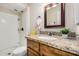 Updated bathroom with granite countertop, a bright mirror, and a stand up shower at 2018 W Taro Ln, Phoenix, AZ 85027