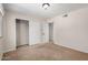 Bedroom with neutral carpet, natural light, and a double door closet to a second room at 2018 W Taro Ln, Phoenix, AZ 85027