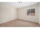 Bedroom with neutral carpet, natural light, and a side view of the neighborhood at 2018 W Taro Ln, Phoenix, AZ 85027