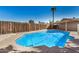 Private backyard featuring a refreshing in-ground pool and wood fence at 2018 W Taro Ln, Phoenix, AZ 85027
