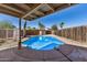 This backyard has a covered patio and refreshing in-ground pool at 2018 W Taro Ln, Phoenix, AZ 85027