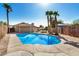 This backyard has a refreshing in-ground pool and mature palm trees at 2018 W Taro Ln, Phoenix, AZ 85027